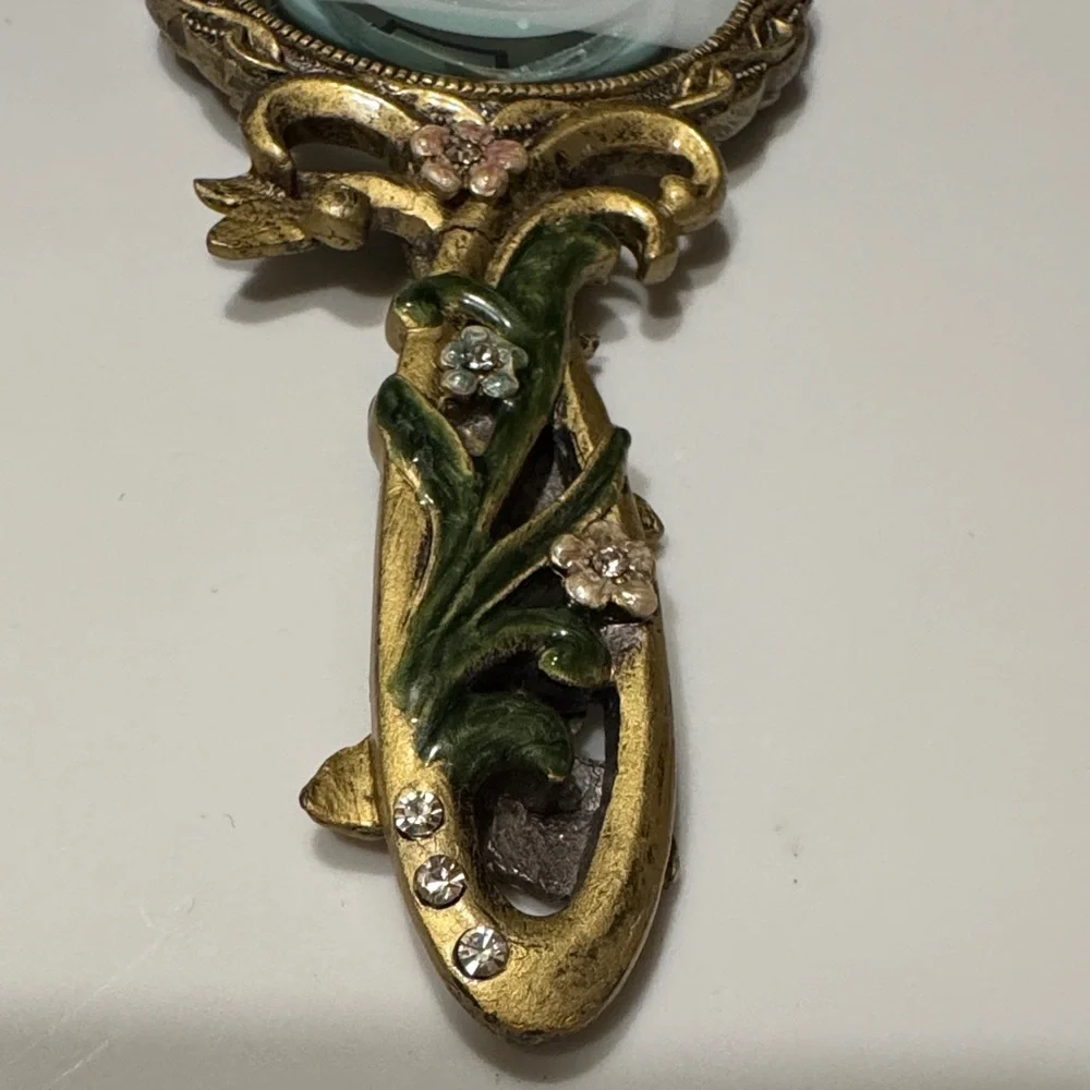 Vintage Handheld Magnifier glass with two intricate Floral Designs